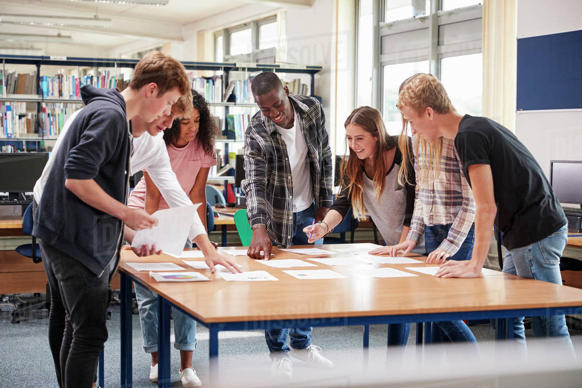 Group Of College Students Collaborating On Project In Library - Stock ...