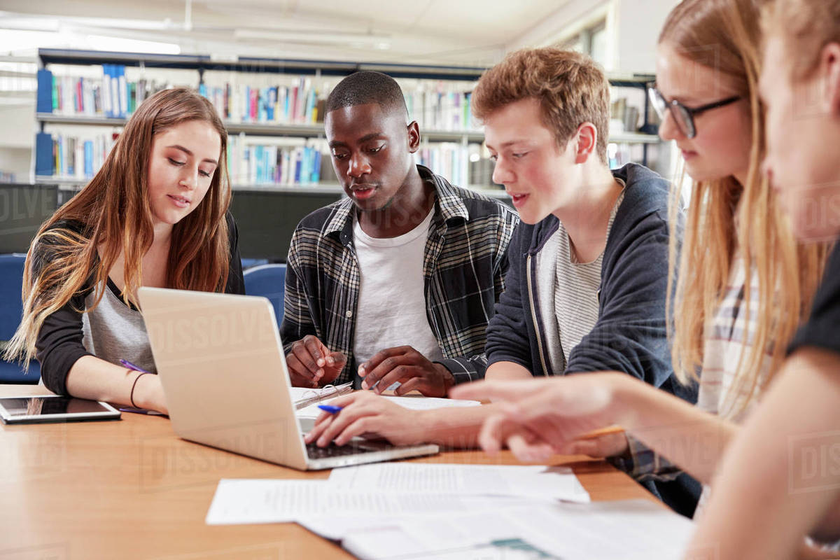 Group Of College Students Collaborating On Project In Library - Stock ...